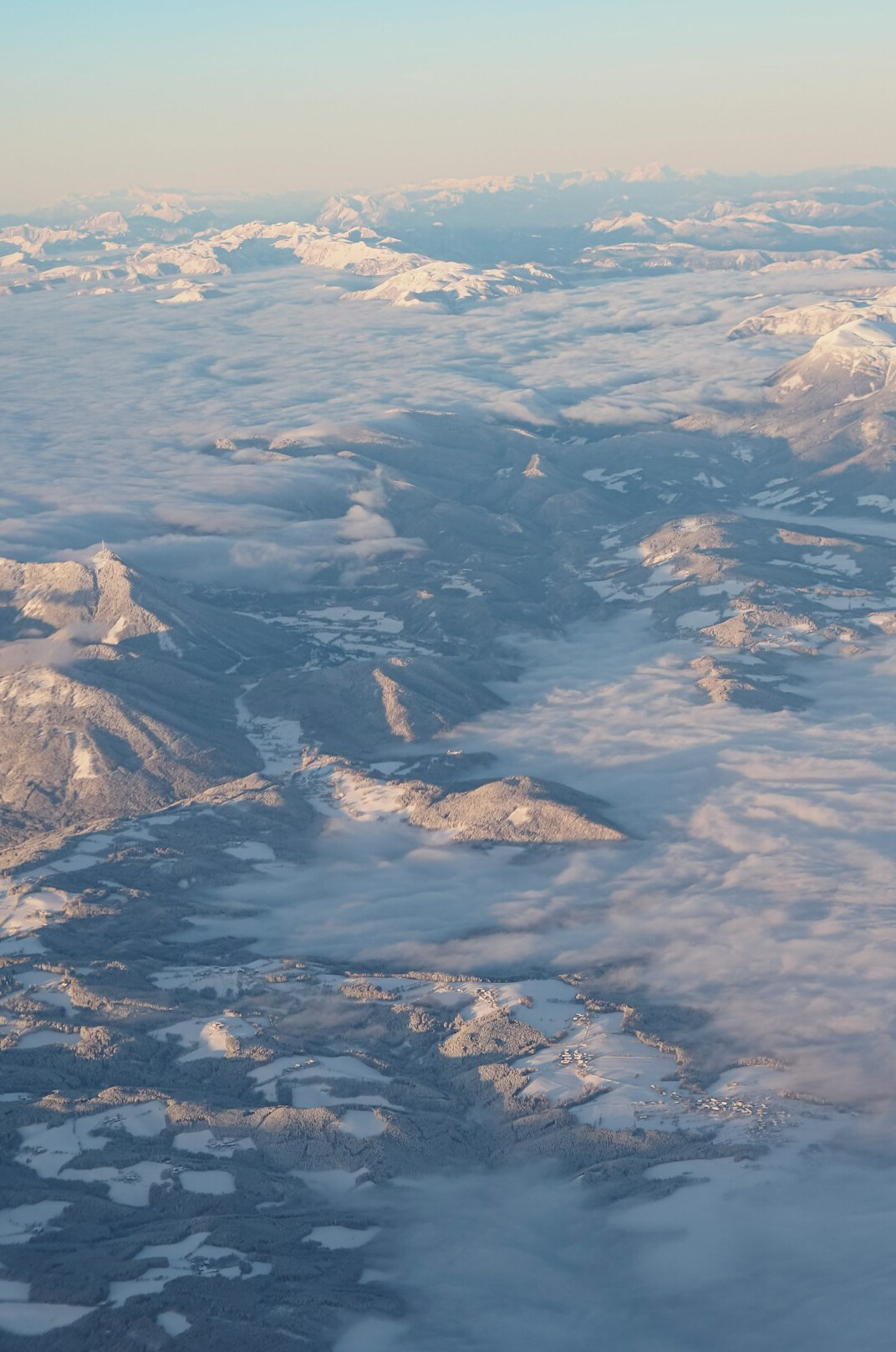 Snowy mountain peaks above a valley