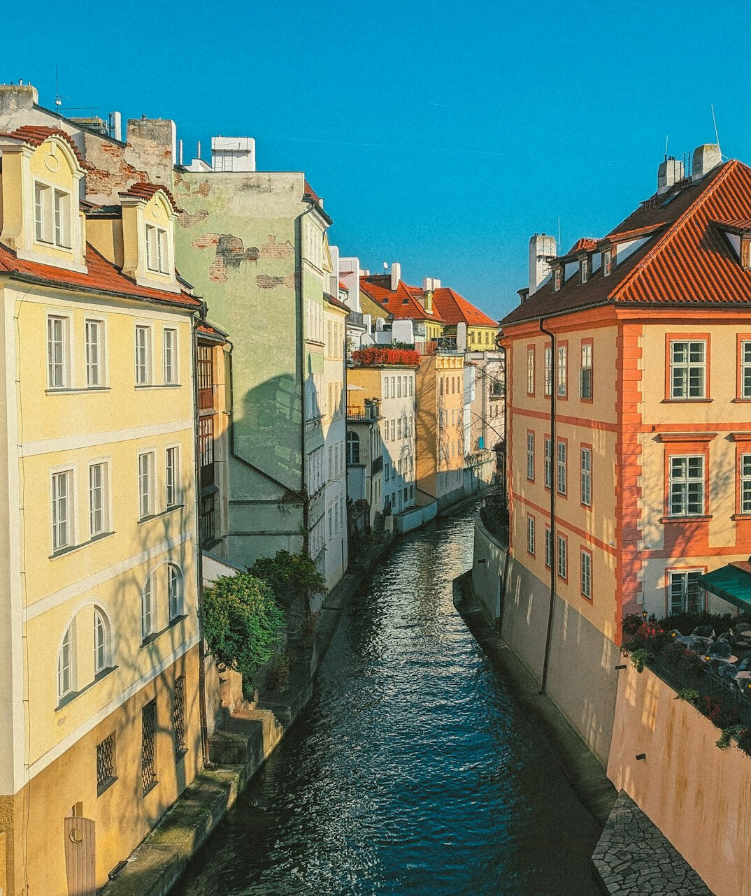 European city street with historic buildings on a sunny day