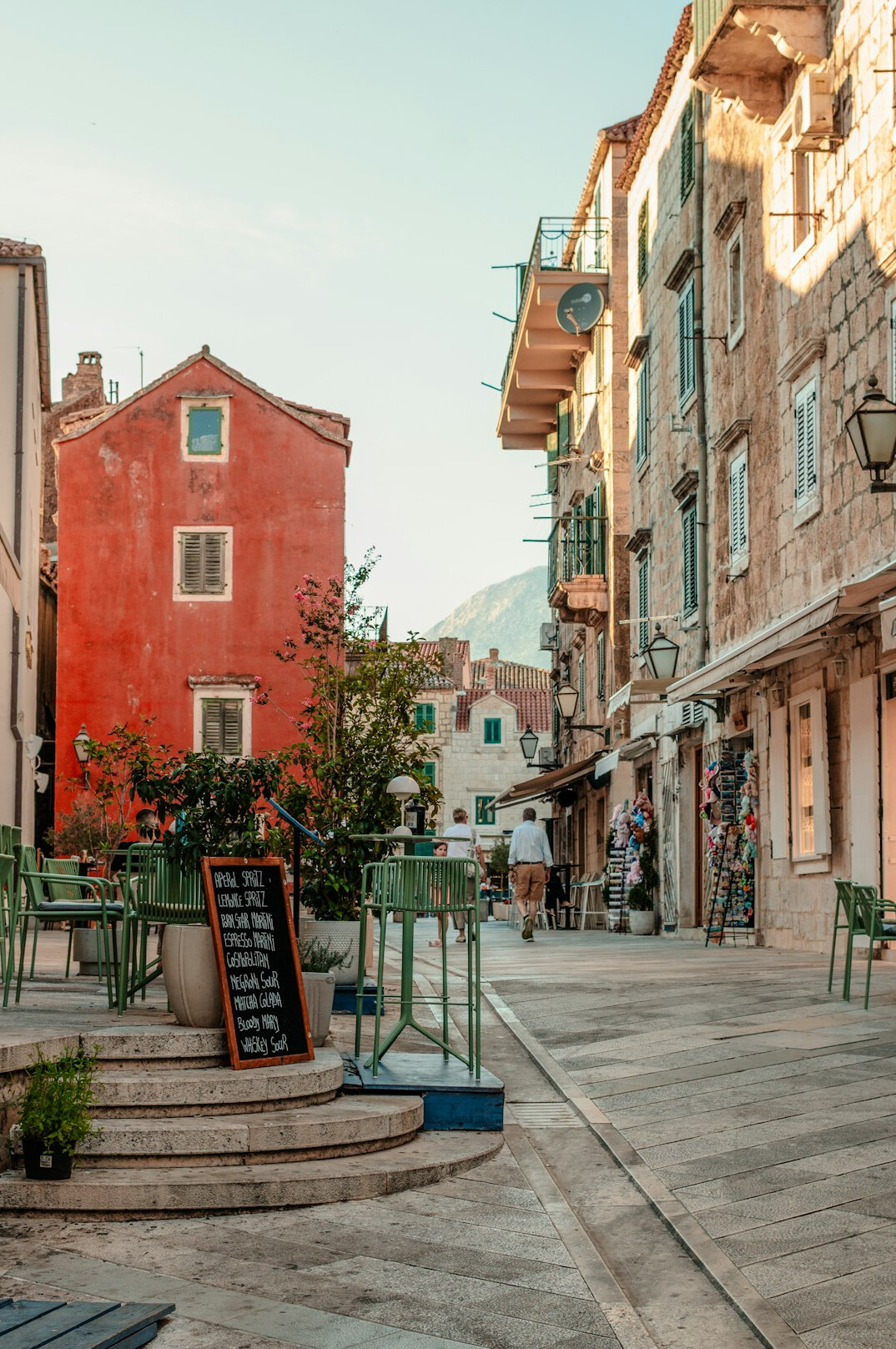 Historic European old town street with cafes and colorful buildings