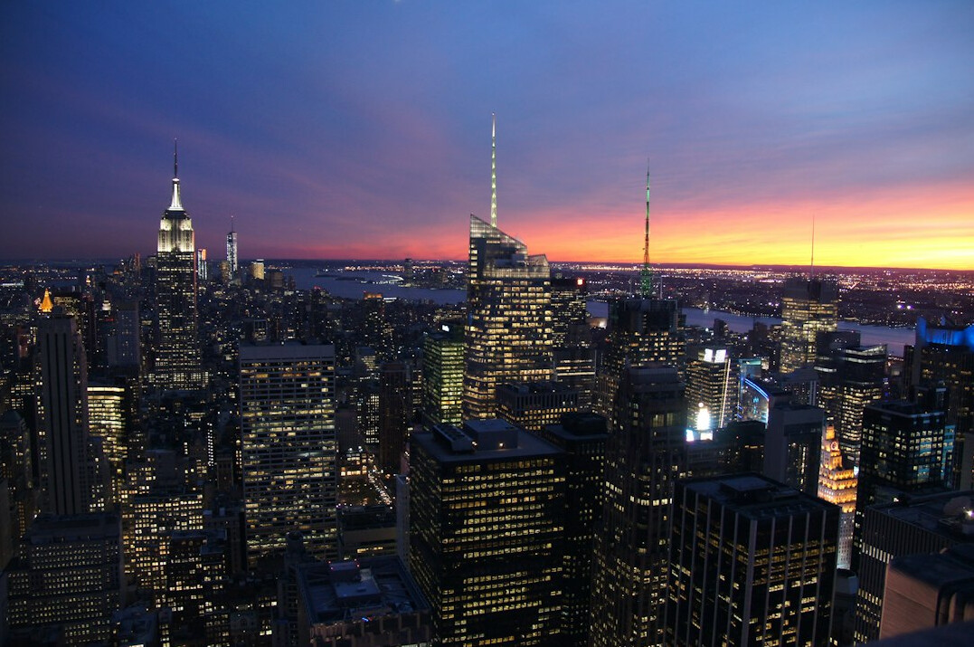 City skyline lit at dusk